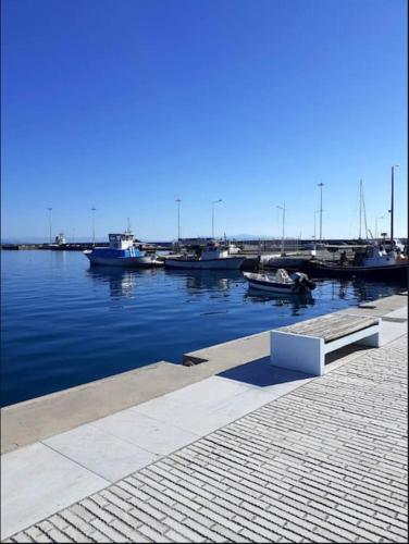 a dock with boats docked in the water at Sarah Delight in Pýrgos