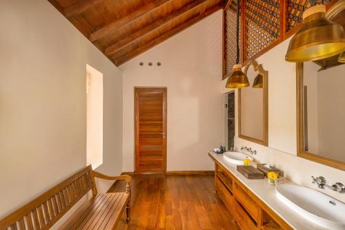 a bathroom with a sink and a mirror at Ishq Colombo in Colombo