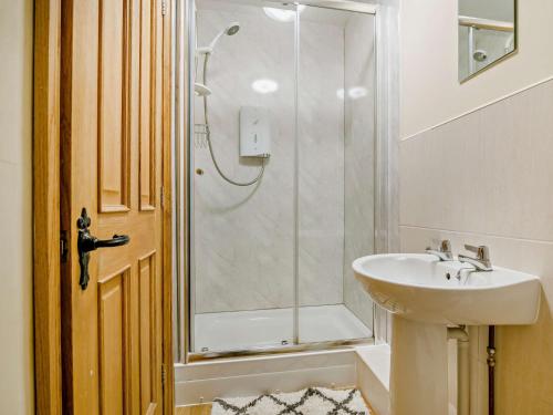 a bathroom with a sink and a shower at 3 bed in Tretower BN124 