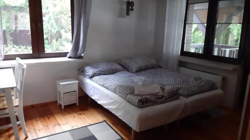 Postel nebo postele na pokoji v ubytování Siedlisko Ostropest Karbowskie 9a