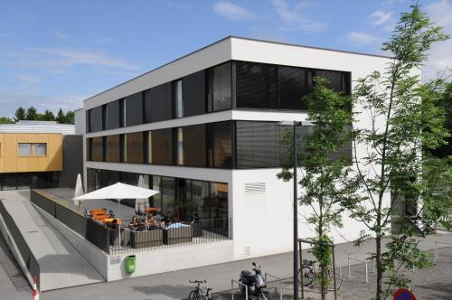 a rendering of a building with a restaurant at Olympiazentrum Vorarlberg in Dornbirn