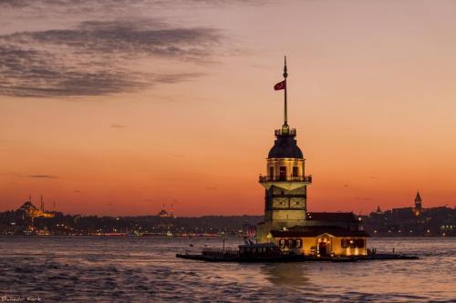 a barge with a flag on top of a lighthouse at İmmortal Hotel İstanbul in Istanbul