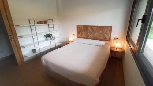 מיטה או מיטות בחדר ב-La finca del Goño