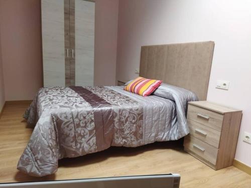 a bedroom with a bed with a dresser and a bed sidx sidx sidx sidx at Casa Souto in Santa Comba