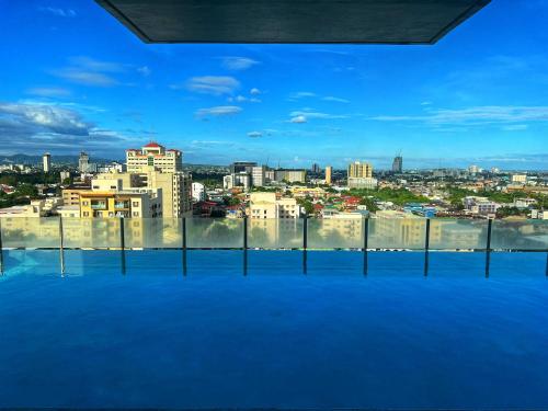 a view of a city from the top of a building at Cozy Studio, super fast internet, workspace and washer in Cebu City