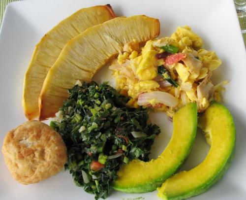 a white plate of food with a plate of food with vegetables at RunAway to Tranquility, overlooking the Bay in Runaway Bay