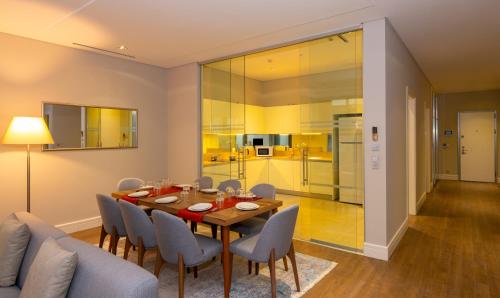 a dining room with a table and chairs at Movenpick Living Istanbul West in Istanbul