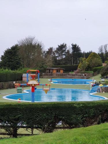 a water park with a water slide in a park at Newquay Blue Water in Newquay