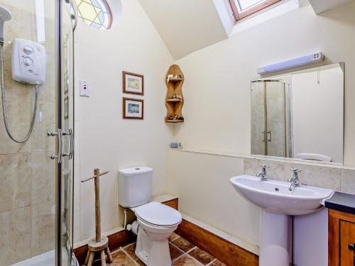 a bathroom with a sink and a toilet and a shower at 1 Bed in Ironbridge 80727 in Leighton
