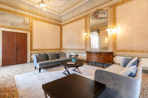 a living room with a couch and a table at Palazzo Keller in Venice