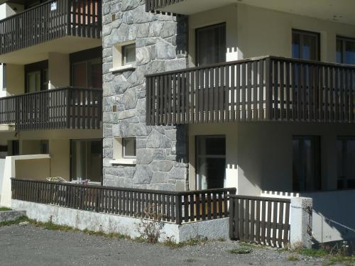 a building with balconies on the side of it at Le petit coin de Montagne in Saint-Lary-Soulan