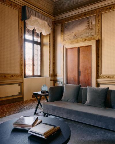 a living room with a couch and a table at Palazzo Keller in Venice