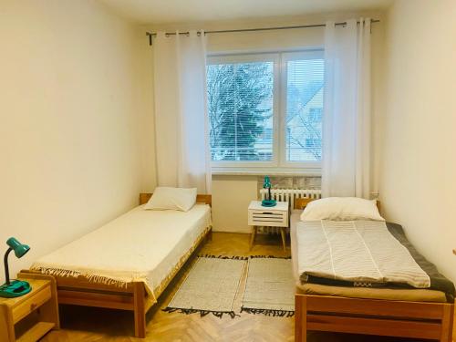 Ліжко або ліжка в номері Apartmán Tatra Kopřivnice