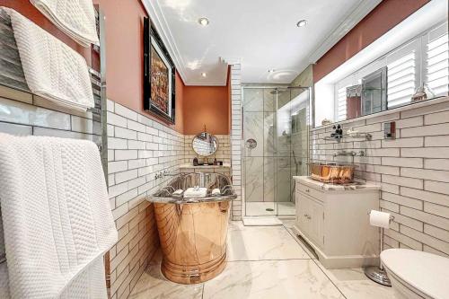 a bathroom with a shower and a sink and a toilet at Little Fox Lodge Luxury Hideaway with Hot Tub Glencoe Near Fortwilliam in Glencoe