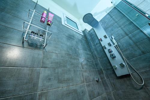 an overhead view of a bathroom with a shower at Eclectic 2BR apartment in Volos