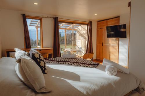 מיטה או מיטות בחדר ב-Patagonia House