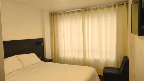 Säng eller sängar i ett rum på Apartamento Andahuaylas