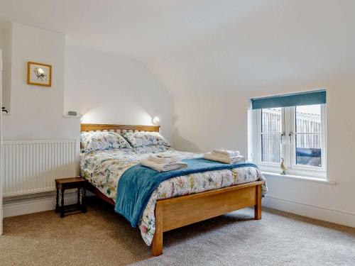 a bedroom with a bed and a window at 1 Bed in Stoke on Tern 85516 