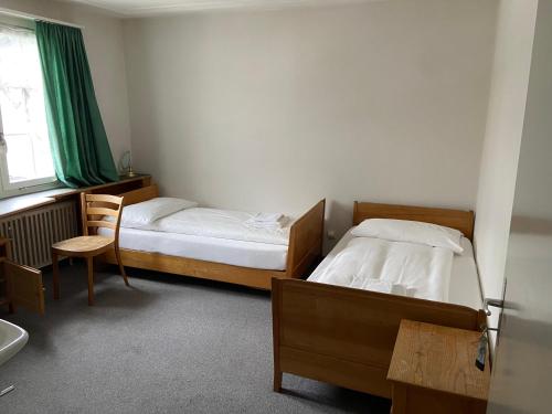 Ein Bett oder Betten in einem Zimmer der Unterkunft Hotel National