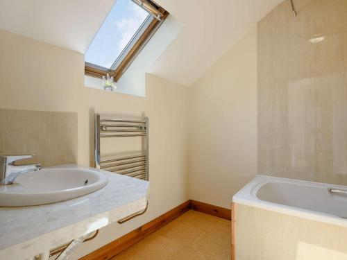 a bathroom with a sink and a bath tub at 2 bed property in Bala North Wales 87274 in Llandderfel