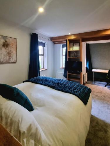 a bedroom with a bed and a piano in a room at Brennan Court Guest Accommodation in Limerick