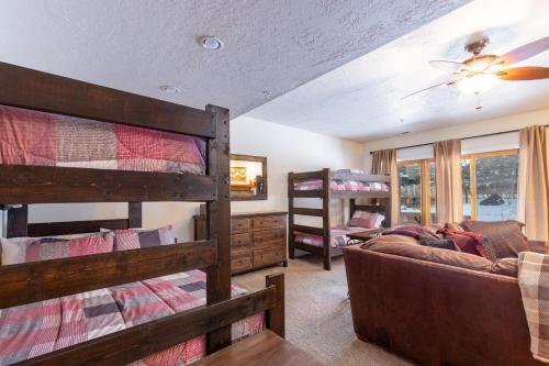a living room with two bunk beds and a couch at Canyon Crossing 21 in Park City