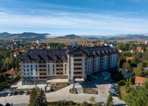 an aerial view of a large building in a city at Sunny Mountain Apartment - Zlatibor, Serbia - SPA & WELLNESS CENTER in Zlatibor