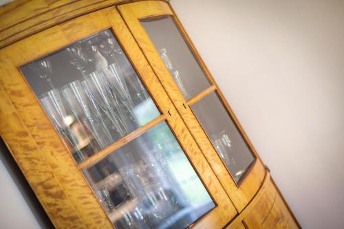a wooden door with two windows in a room at Sylthause in Archsum