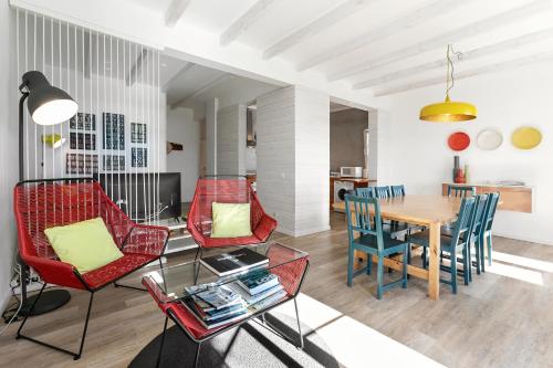 a living room with a dining room table and chairs at Silver Coast - Casa da Lagoa in Foz do Arelho