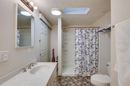 a bathroom with a sink and a shower at Tree-Lined Glenburn Vacation Rental with Fire Pit! in West Glenburn