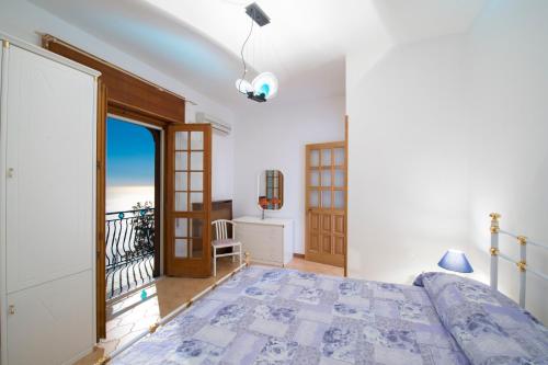 Giường trong phòng chung tại Villa Finizia
