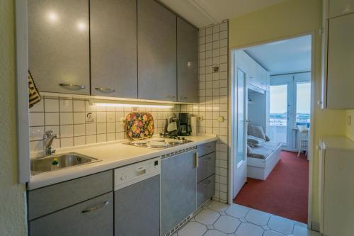 a kitchen with a sink and a counter top at Metropol-276 in Westerland