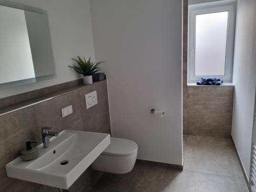 Ένα μπάνιο στο Glückauf - Gemütliche Ferienwohnung nahe Steinhude