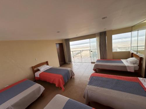 Postel nebo postele na pokoji v ubytování YOLO House Peru