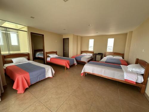 Ένα ή περισσότερα κρεβάτια σε δωμάτιο στο YOLO House Peru