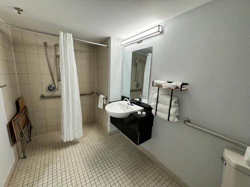 a bathroom with a sink and a shower and a toilet at Motel 6 East Syracuse, NY - Airport in East Syracuse