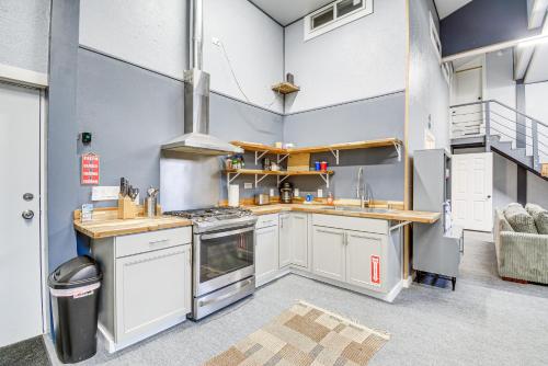 a kitchen with white cabinets and a stove top oven at Westport Home with Hot Tub 2 Blocks to Beach! in Westport