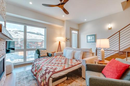 a living room with a bed and a large window at Silverthorne Mountain Retreat Near A-Basin! in Silverthorne