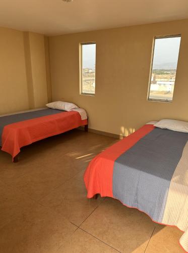 Ένα ή περισσότερα κρεβάτια σε δωμάτιο στο YOLO House Peru