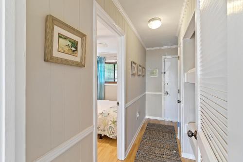 a hallway with a door leading to a bedroom at 206A Sea Cabin in Isle of Palms