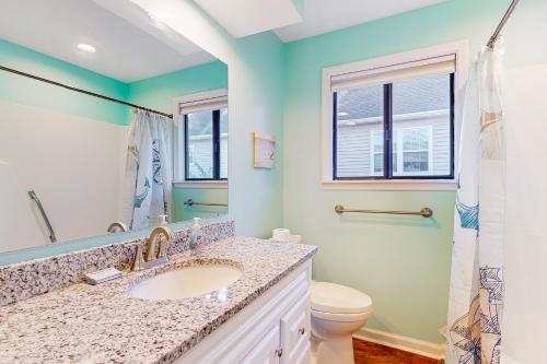 a bathroom with a sink and a toilet at Maple Leaves - 30 Day Rental in Charleston