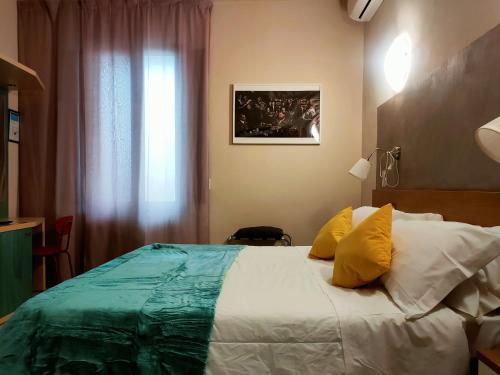 Ένα ή περισσότερα κρεβάτια σε δωμάτιο στο Hotel Il Boschetto
