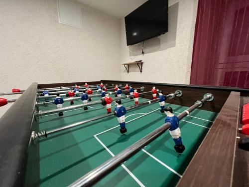 a group of people playing a game of billiard at Gîte Au Creux Du Moulin in Bussang