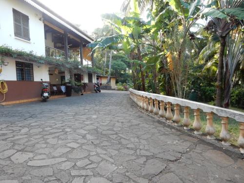 a cobblestone street in front of a building at Sarl Mayoume in Mamoudzou