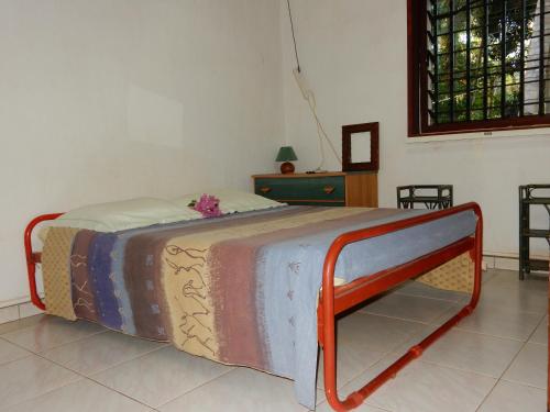 a bed sitting in a room with at Sarl Mayoume in Mamoudzou