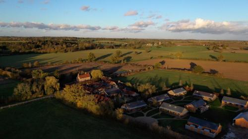 an aerial view of a house in a field at Retreat East in Ipswich