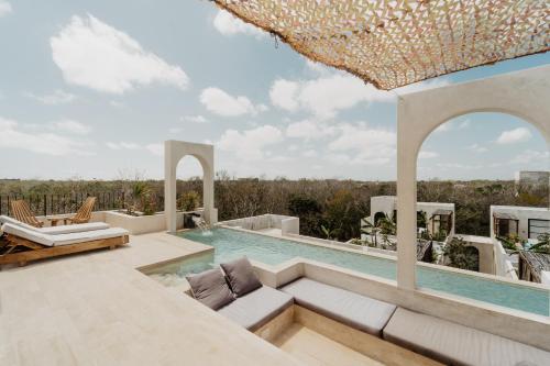 a swimming pool in a villa at Villa Viento 4br 8pp Private Pool Rooftop Security in Tulum