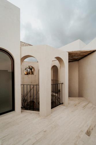an empty room with white walls and a ceiling at Villa Viento 4br 8pp Private Pool Rooftop Security in Tulum