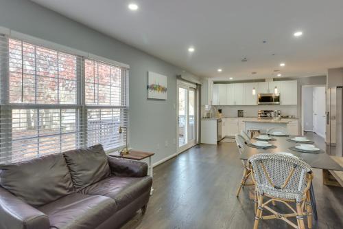 a living room with a couch and a table at 8 Mi to National Mall Quiet Cheverly Apt in Landover