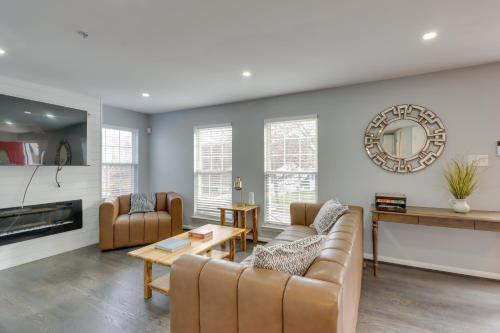 a living room with a couch and a table at 8 Mi to National Mall Quiet Cheverly Apt in Landover